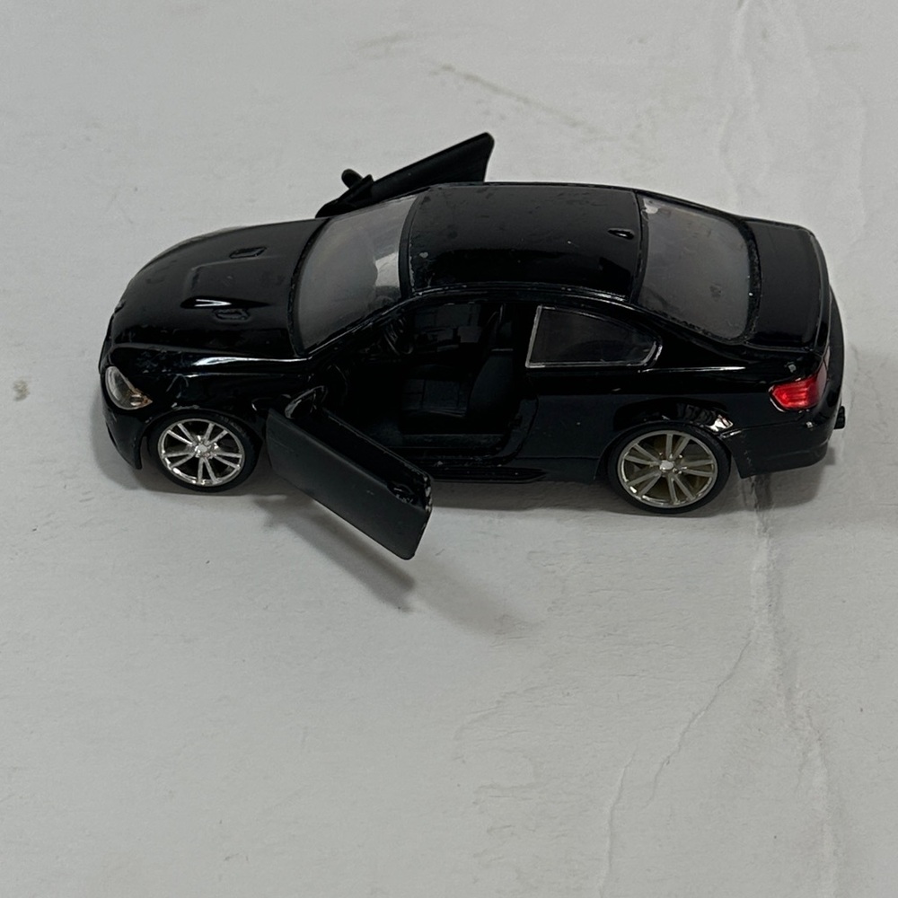 Sleek Black BMW Model with Opening Doors